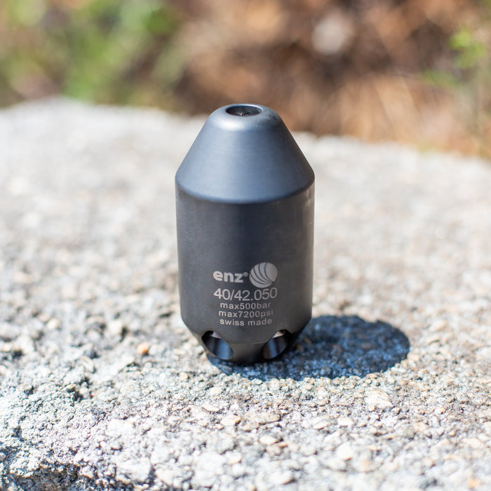 Enz Grenade 40/42.050 high‑pressure sewer jetting nozzle, Swiss‑made stainless steel rotary cleaning nozzle rated to 500 bar / 7200 psi, shown on concrete surface for industrial drain and pipe cleaning.