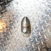 Reaper Rotating Nozzle on a diamond‑plate surface, featuring a polished stainless‑steel body with the engraved Reaper logo. This high‑pressure sewer jetting nozzle delivers a powerful forward oscillating jet and four rear propulsion jets to cut blockages, penetrate roots, and clear grease with a cone‑shaped spray pattern. Precision‑machined design ideal for professional drain cleaning, available in multiple pressure and flow sizes from US Jetting.