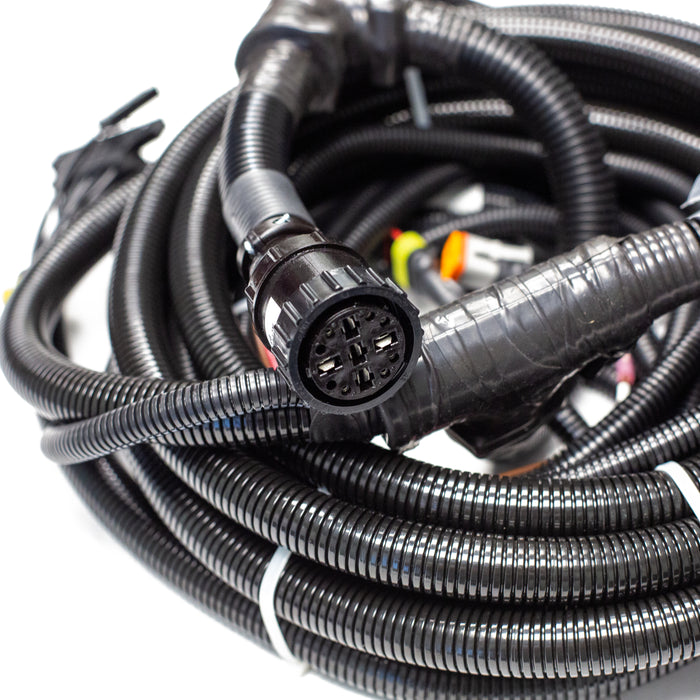Tier 3 engine wiring harness with multi‑pin connector, corrugated loom tubing, and control‑panel leads for US Jetting jetter systems.